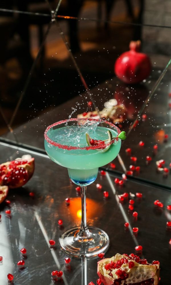 blue-cocktail-with-pomegranate-and-syrup-side-view-2023-11-27-05-14-05-utc